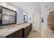 Elegant bathroom boasts dual vanities, granite countertops, and luxurious fixtures for a spa-like experience at 1212 Lee Whatley Dr, Lithonia, GA 30058
