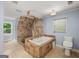 Luxurious bathroom features a soaking tub and a separate tiled shower, offering a relaxing retreat at 1212 Lee Whatley Dr, Lithonia, GA 30058
