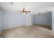 Spacious bedroom with a ceiling fan and neutral carpeting, bathed in natural light at 1212 Lee Whatley Dr, Lithonia, GA 30058