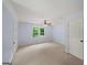 Clean bedroom with carpet, light blue walls and a ceiling fan with lighting at 1212 Lee Whatley Dr, Lithonia, GA 30058