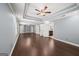 An expansive main bedroom with hardwood flooring, ceiling fan, and an en suite bathroom at 1212 Lee Whatley Dr, Lithonia, GA 30058