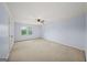 Cozy bedroom with carpeted floors, light blue walls, and a ceiling fan at 1212 Lee Whatley Dr, Lithonia, GA 30058
