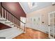 Bright foyer with hardwood floors, grand staircase, and ample natural light at 1212 Lee Whatley Dr, Lithonia, GA 30058