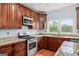 Well-equipped kitchen with stainless steel appliances and granite countertops at 1212 Lee Whatley Dr, Lithonia, GA 30058