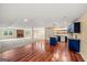 Open concept living room, featuring a fireplace and access to a kitchen with an island at 1212 Lee Whatley Dr, Lithonia, GA 30058