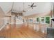 Spacious living room with hardwood floors, high ceilings, ceiling fans, and ample natural light at 1212 Lee Whatley Dr, Lithonia, GA 30058