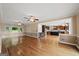 Open-concept living room with hardwood floors flowing into the kitchen at 1212 Lee Whatley Dr, Lithonia, GA 30058