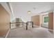Spacious loft area featuring a fireplace, large windows, and carpeted flooring at 1212 Lee Whatley Dr, Lithonia, GA 30058