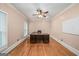 Home office features a large desk, hardwood floors, and ample natural light from a window at 1212 Lee Whatley Dr, Lithonia, GA 30058