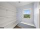 Pantry with shelving and a window offering natural light at 1212 Lee Whatley Dr, Lithonia, GA 30058