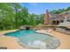 The backyard features a large pool with a slide, outdoor fireplace, and sprawling backyard at 1212 Lee Whatley Dr, Lithonia, GA 30058