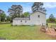 Backyard of the house features a well-manicured lawn and patio with swing and a fire pit at 1125 Babbs Mill Rd, Hampton, GA 30228