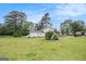 Expansive backyard with a fire pit area, perfect for outdoor activities and relaxation at 1125 Babbs Mill Rd, Hampton, GA 30228