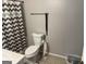 Standard bathroom with a functional toilet and white tiled floors at 1125 Babbs Mill Rd, Hampton, GA 30228