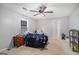 Carpeted bedroom with a single window, ceiling fan and doorway leading to the bathroom at 1125 Babbs Mill Rd, Hampton, GA 30228