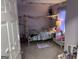 Bright bedroom featuring a charming bed frame and light purple colored walls at 1125 Babbs Mill Rd, Hampton, GA 30228