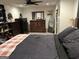 Cozy bedroom featuring a large bed, dresser, and ample storage space at 1125 Babbs Mill Rd, Hampton, GA 30228