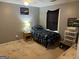 Comfortable bedroom featuring grey walls, a ceiling fan and cozy decor at 1125 Babbs Mill Rd, Hampton, GA 30228