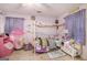 Bright bedroom with playful decor, including a canopy bed, a tent and colorful accents at 1125 Babbs Mill Rd, Hampton, GA 30228