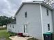 Two-story home with light blue siding and an outdoor patio with a red wagon at 1125 Babbs Mill Rd, Hampton, GA 30228