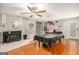 Spacious game room with hardwood floors, a fireplace, a ceiling fan, and a pool table at 1125 Babbs Mill Rd, Hampton, GA 30228