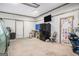 Spacious garage with paneled walls, painted doors and a work bench on the back wall at 1125 Babbs Mill Rd, Hampton, GA 30228