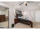 This main bedroom is large, carpeted and features mirrored closet doors and a ceiling fan for extra comfort at 1125 Babbs Mill Rd, Hampton, GA 30228