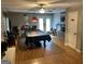 Spacious recreation room featuring a pool table, ceiling fan and door leading to the exterior at 1125 Babbs Mill Rd, Hampton, GA 30228