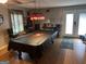 Well-lit recreation room featuring a pool table with a Georgia Bulldogs cover at 1125 Babbs Mill Rd, Hampton, GA 30228
