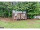Charming shed offers additional storage and complements the property's outdoor amenities at 1125 Babbs Mill Rd, Hampton, GA 30228