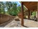 A beautiful back patio with a fire pit and outdoor seating under the deck, ready for entertaining or relaxing at 2294 Hollonville Rd, Brooks, GA 30205