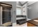 Elegant bathroom with soaking tub, shower with dark tile, and chandelier at 2294 Hollonville Rd, Brooks, GA 30205