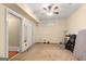 Bedroom with neutral carpet, double closets, ceiling fan, and baseboard trim with window at 2294 Hollonville Rd, Brooks, GA 30205