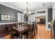 Dining room featuring hardwood floors and decorative light fixture at 2294 Hollonville Rd, Brooks, GA 30205