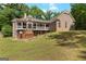 Beautiful back elevation of home with covered porch, deck and outdoor enjoyment at 2294 Hollonville Rd, Brooks, GA 30205
