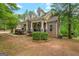 Charming home exterior featuring brick, stone accents, dormer windows and a welcoming front porch at 2294 Hollonville Rd, Brooks, GA 30205