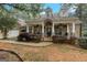 Inviting home exterior with stone porch, walkway, columns, and manicured landscaping at 2294 Hollonville Rd, Brooks, GA 30205