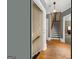 Inviting hallway with hardwood floors, staircase, and view into another room at 2294 Hollonville Rd, Brooks, GA 30205