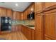 Well-equipped kitchen featuring wood cabinets, granite countertops, and stainless steel appliances at 2294 Hollonville Rd, Brooks, GA 30205
