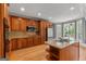 Bright kitchen boasting wood cabinets, granite countertops, stainless appliances, and hardwood floors at 2294 Hollonville Rd, Brooks, GA 30205