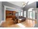 Inviting living room with hardwood floors, arched windows, and an open view to the kitchen at 2294 Hollonville Rd, Brooks, GA 30205