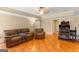 Spacious living room with beautiful ceramic tile floors and comfortable couches and trim and a treadmill at 2294 Hollonville Rd, Brooks, GA 30205