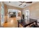 Home office featuring hardwood floors, a desk, and large window at 2294 Hollonville Rd, Brooks, GA 30205