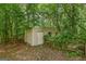 Storage shed with garage door, offering plenty of space for all your storage needs at 2294 Hollonville Rd, Brooks, GA 30205