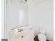 Simple half bathroom with a white vanity and toilet at 3652 Platina Park Ct, Decatur, GA 30034