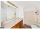 Bathroom with a vanity, large mirror, and a tub-shower combination at 3652 Platina Park Ct, Decatur, GA 30034