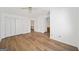Bright bedroom with light wood floors, large closets and a makeup vanity area at 3652 Platina Park Ct, Decatur, GA 30034