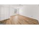 Spacious bedroom featuring light wood floors, large window, and ample closet space at 3652 Platina Park Ct, Decatur, GA 30034