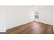 Cozy bedroom featuring laminate flooring, white walls, and a bright window at 3652 Platina Park Ct, Decatur, GA 30034
