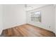Bright bedroom featuring natural light, wood-look laminate flooring, and neutral paint at 3652 Platina Park Ct, Decatur, GA 30034